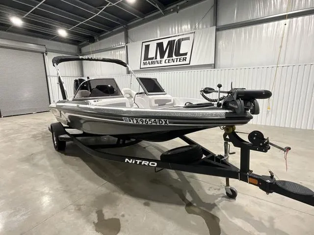 Slide: The Image of 2019 Nitro Z19 Sport boat in showroom, displayed on trailer at LMC Marine Center. - 6
