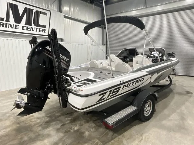 Slide: The Image of 2019 Nitro Z19 Sport boat in showroom, featuring Mercury outboard motor. - 7