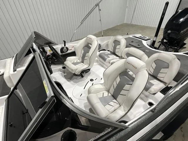 Slide: The Image of 2019 Nitro Z19 Sport boat interior with white and gray seating. - 9