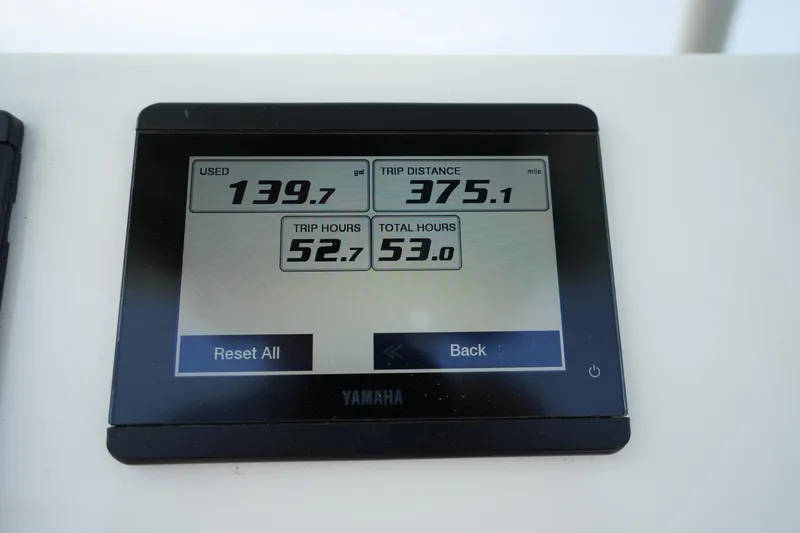 Slide: The Image of Display screen on 2023 Key West 219 FS showing trip data and fuel usage. - 27
