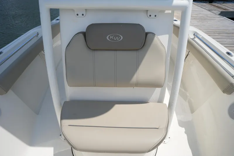 Slide: The Image of 2023 Key West 219 FS boat seating with beige cushions and KW logo. - 31