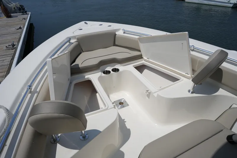 Slide: The Image of 2023 Key West 219 FS boat interior with open storage compartments and seating. - 34