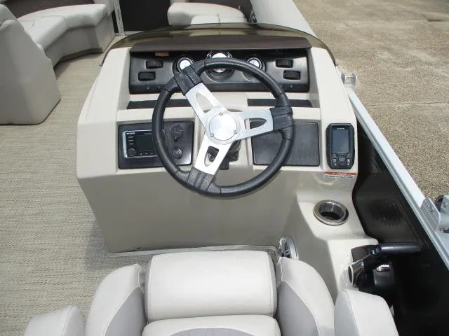 Slide: The Image of 2018 Bennington 22SLXP boat dashboard with steering wheel and controls. - 3