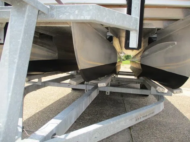 Slide: The Image of 2018 Bennington 22SLXP pontoon boat on a trailer, viewed from below. - 7