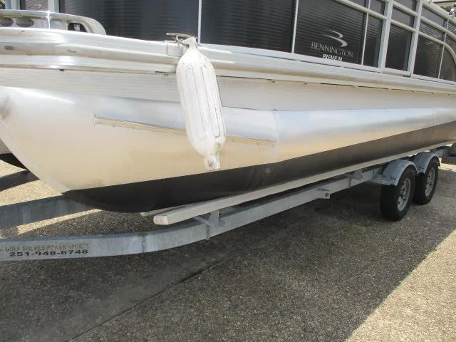 Slide: The Image of 2018 Bennington 22SLXP pontoon boat on a trailer, side view. - 8