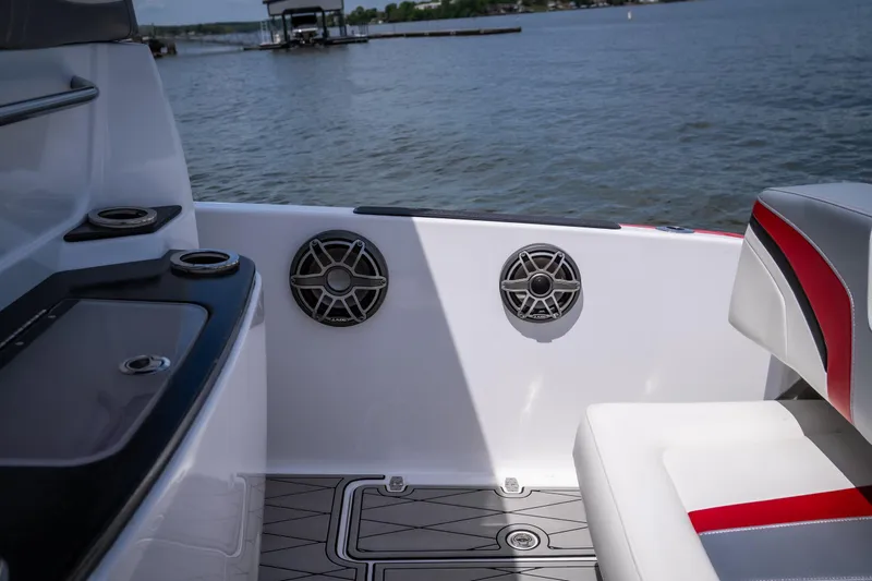 Slide: The Image of 2017 Sunsation 34 CCX boat interior with speakers, seating, and water view. - 20