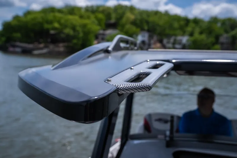 Slide: The Image of 2017 Sunsation 34 CCX boat detail with sleek design on a sunny day by the water. - 30