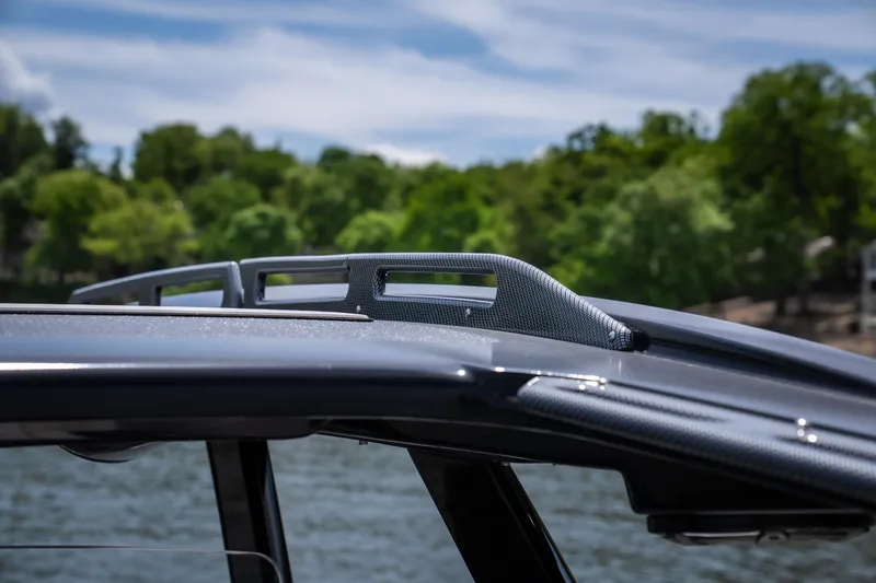 Slide: The Image of 2017 Sunsation 34 CCX boat roof detail with scenic water and trees in the background. - 31