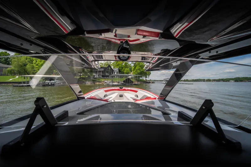 Slide: The Image of 2017 Sunsation 34 CCX boat interior view, showcasing sleek design and lake scenery. - 45