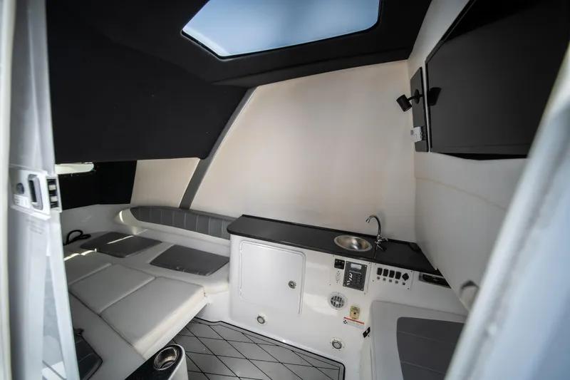 Slide: The Image of Interior of 2017 Sunsation 34 CCX boat with modern amenities and sleek design. - 49