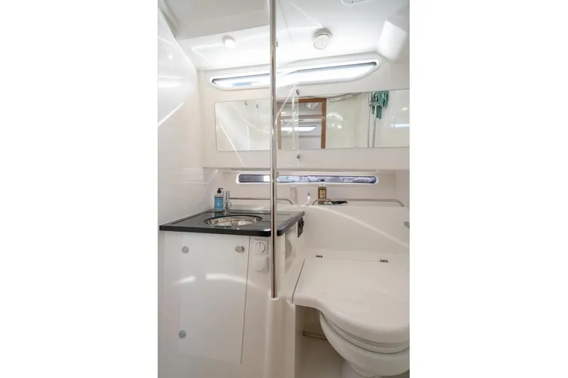 Slide: The Image of Modern bathroom interior in 2022 Nimbus T11 boat, featuring sleek design and compact amenities. - 15