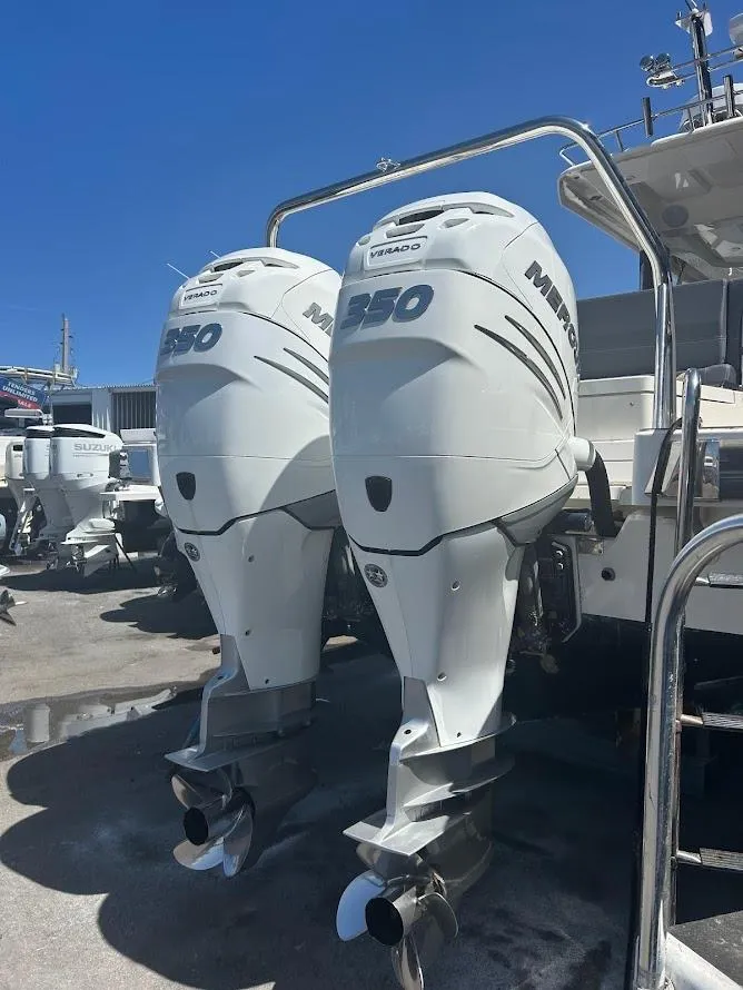 Slide: The Image of Luxurious interior of 2022 Nimbus T11 boat with wood finishes and cozy seating area. - 14