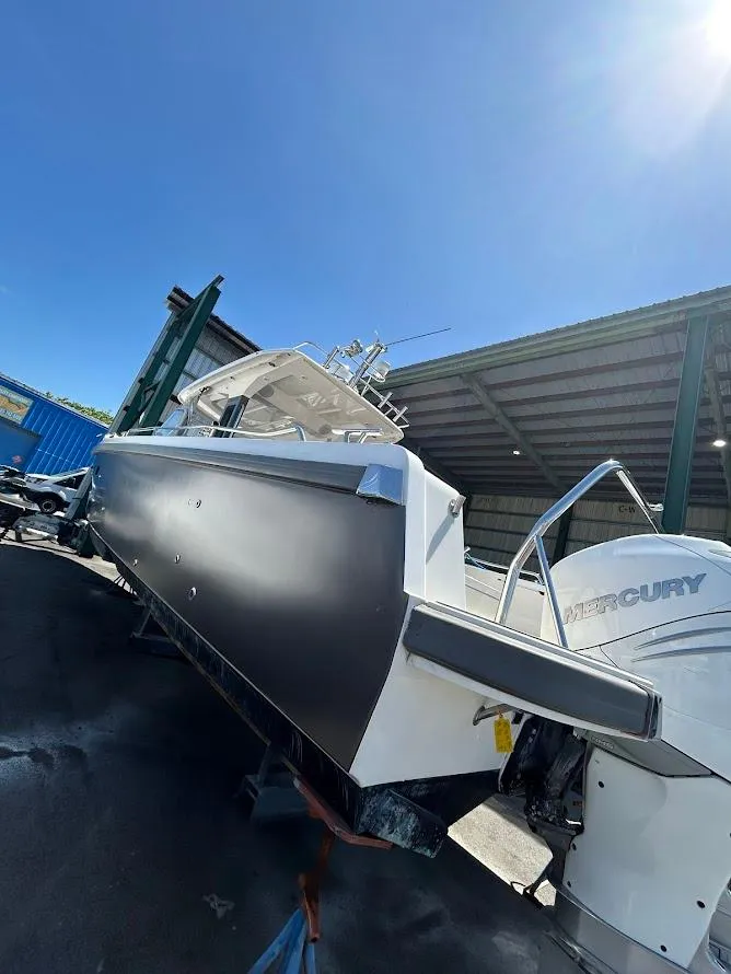 Slide: The Image of 2022 Nimbus T11 boat with sleek design, spacious seating, and modern amenities. - 2