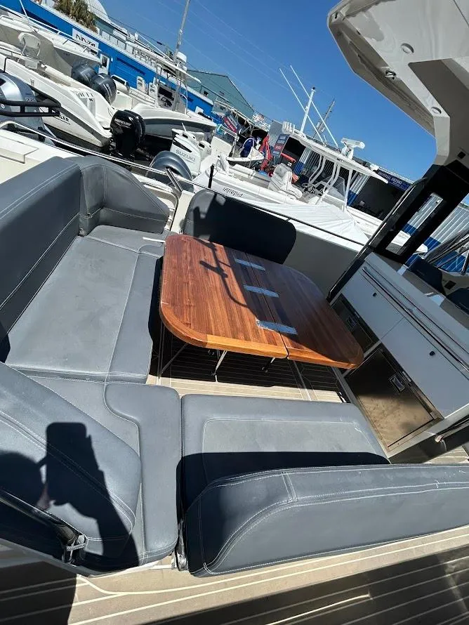 Slide: The Image of 2022 Nimbus T11 boat in storage, featuring sleek design and modern equipment. - 4