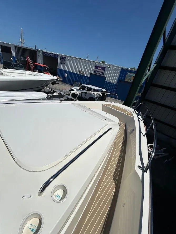 Slide: The Image of Nimbus T11 2022 boat awning against clear blue sky. - 6