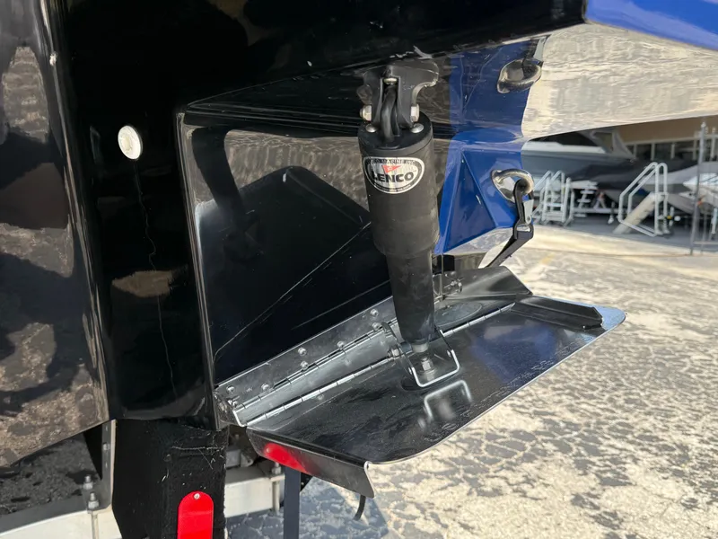 Slide: The Image of 2019 Monterey MX6 SURF boat trim tab and actuator detail. - 37