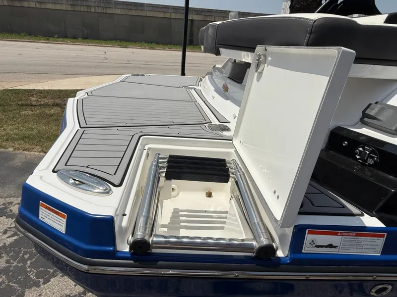 Slide: The Image of 2019 Monterey MX6 SURF boat with open swim platform ladder. - 40