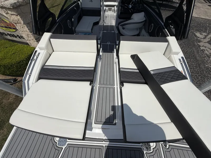 Slide: The Image of 2019 Monterey MX6 SURF boat interior with white and black seating, sleek design. - 41