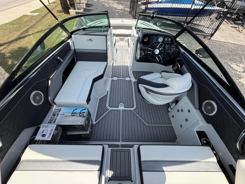 Slide: The Image of 2019 Monterey MX6 SURF boat interior with sleek seating and modern dashboard design. - 43