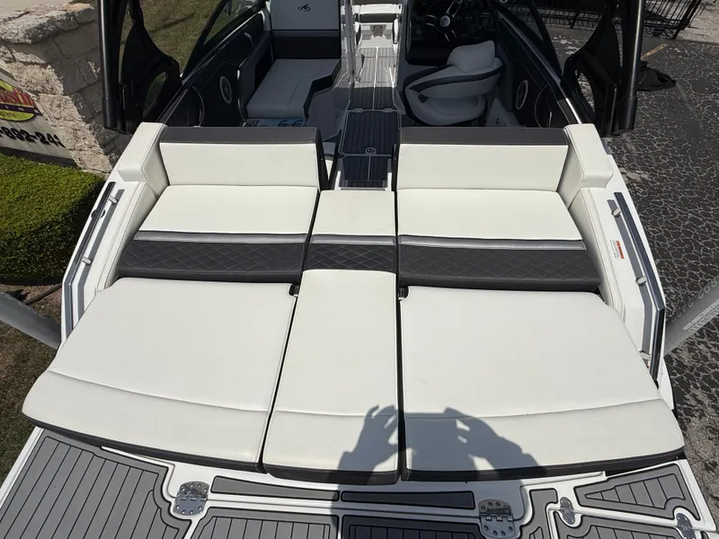Slide: The Image of 2019 Monterey MX6 SURF boat with spacious white seating and sleek design. - 47