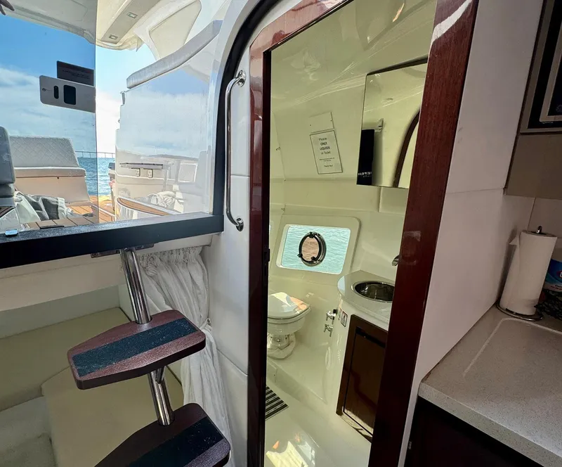 Slide: The Image of Interior view of 2023 Schaefer 375 yacht, featuring a compact bathroom and modern design. - 13