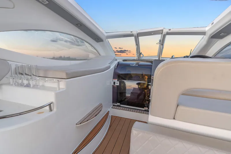 Slide: The Image of Luxurious interior of 2023 Schaefer 375 yacht with sunset view through windows. - 23