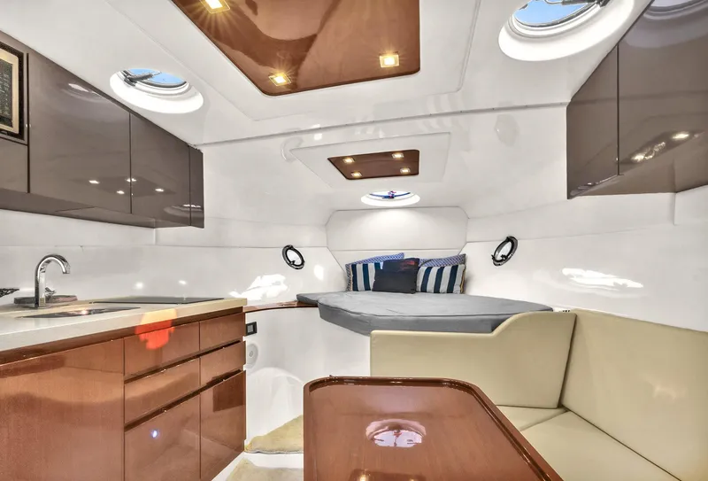 Slide: The Image of Luxurious interior of 2023 Schaefer 375 yacht with modern kitchen and cozy sleeping area. - 4