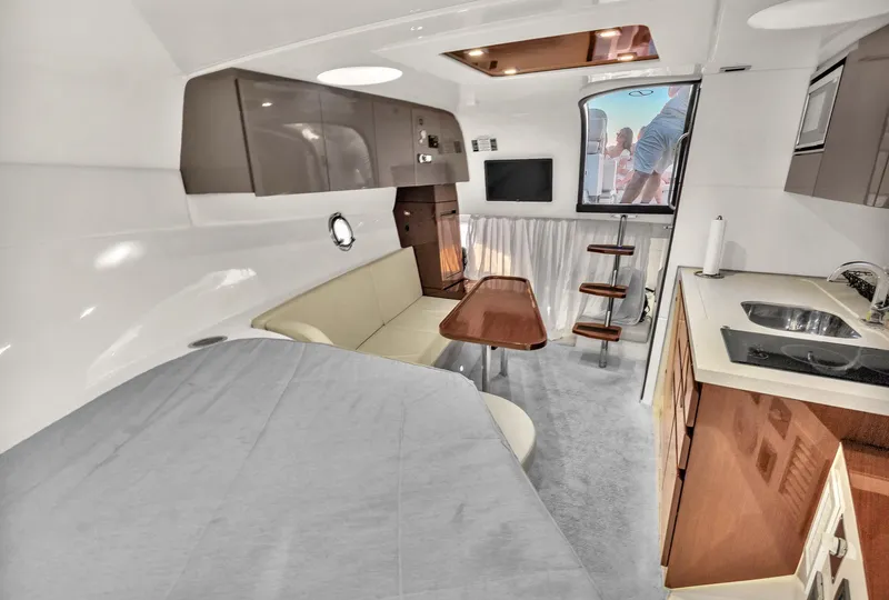 Slide: The Image of Interior of 2023 Schaefer 375 yacht with modern kitchen, seating, and dining area. - 5