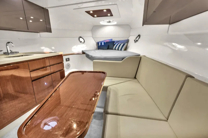 Slide: The Image of Luxurious interior of 2023 Schaefer 375 yacht with modern seating and kitchenette. - 6