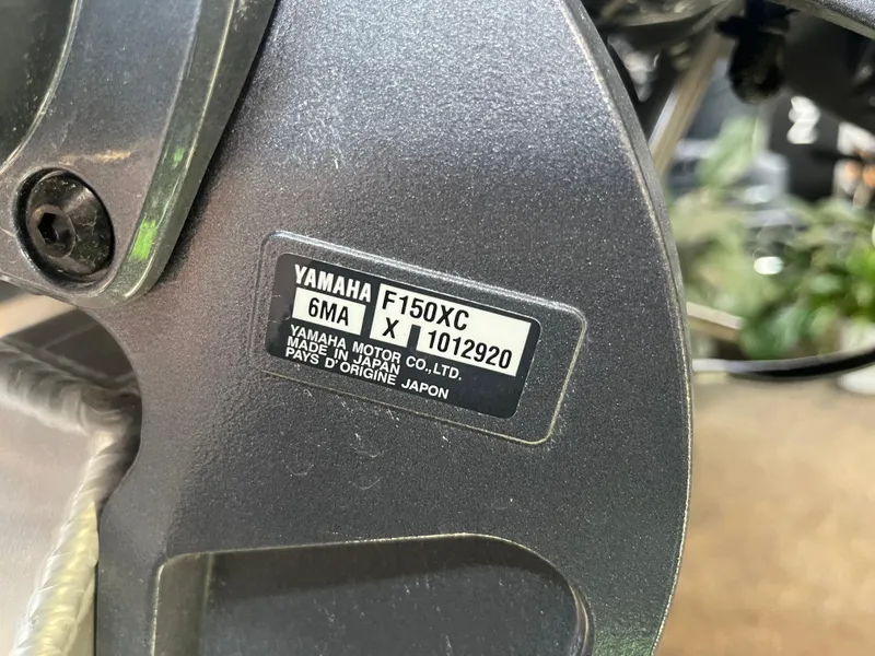 Slide: The Image of Close-up of Yamaha F150XC engine label on a 2025 Bennington 22SXSRC boat. - 14