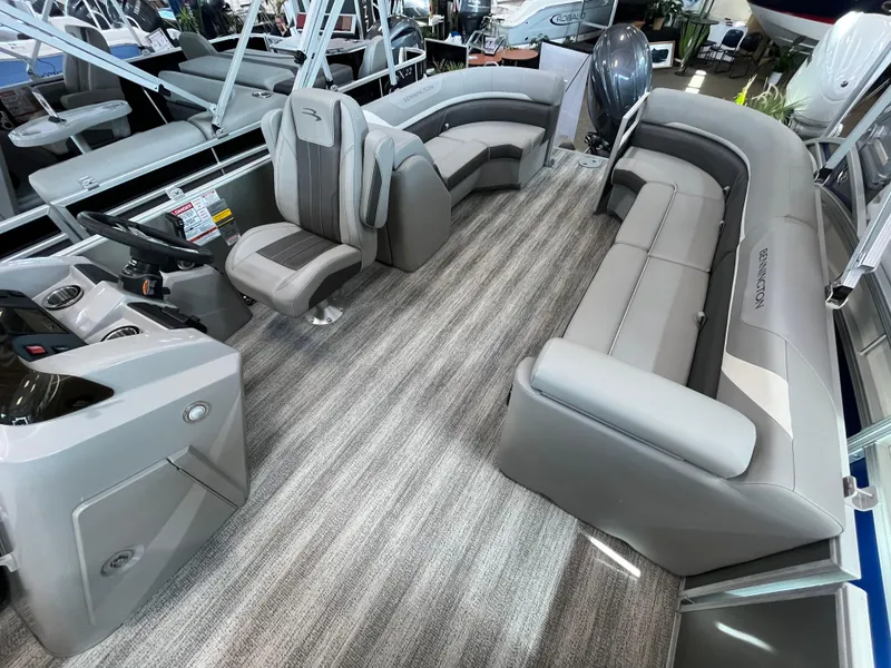 Slide: The Image of 2025 Bennington 22SXSRC pontoon boat interior with plush seating and modern design. - 3