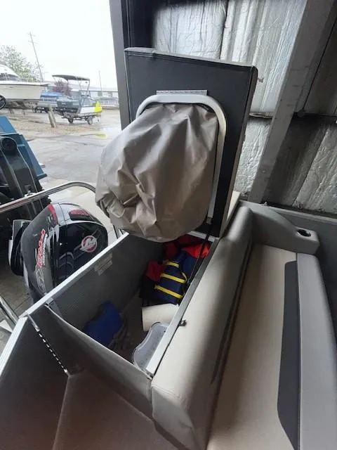 Slide: The Image of 2023 Princecraft Vectra 23 LT storage compartment with life jackets and equipment. - 17