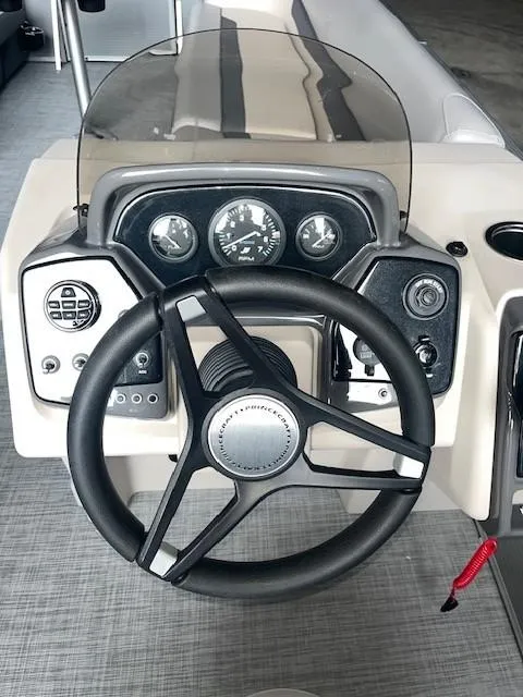 Slide: The Image of 2023 Princecraft Vectra 23 LT boat dashboard with steering wheel and gauges. - 19