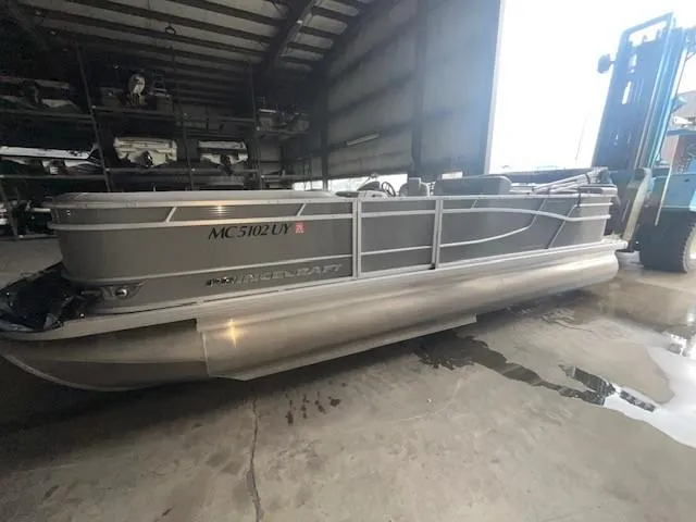 Slide: The Image of 2023 Princecraft Vectra 23 LT pontoon boat in a storage facility. - 3