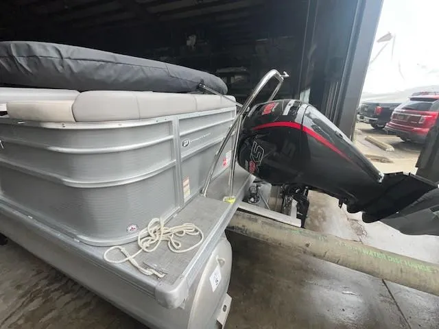 Slide: The Image of 2023 Princecraft Vectra 23 LT pontoon boat with outboard motor in a garage. - 4