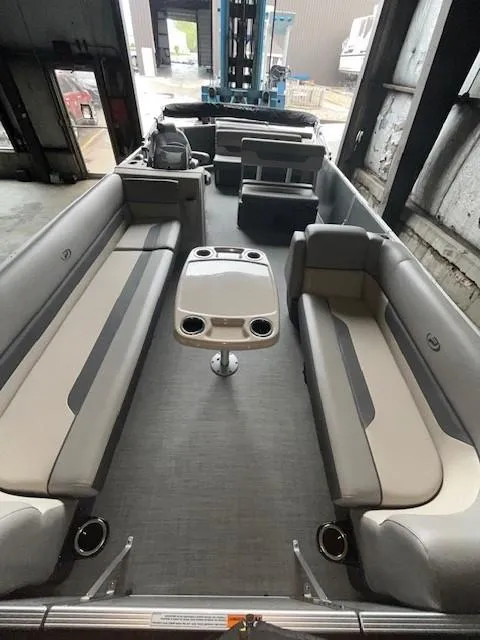 Slide: The Image of 2023 Princecraft Vectra 23 LT pontoon boat interior with gray seating and central table. - 5