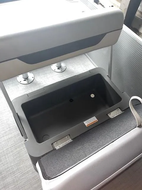 Slide: The Image of 2023 Princecraft Vectra 23 LT boat storage compartment with open lid, showcasing interior space. - 8