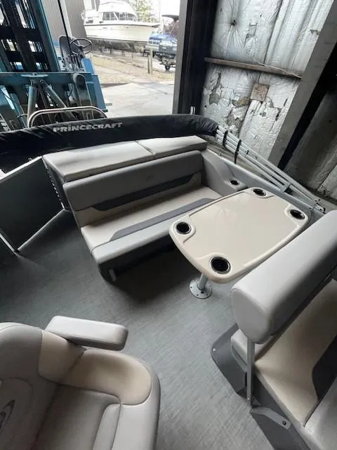 Slide: The Image of 2023 Princecraft Vectra 23 LT pontoon boat interior with seating and table. - 9
