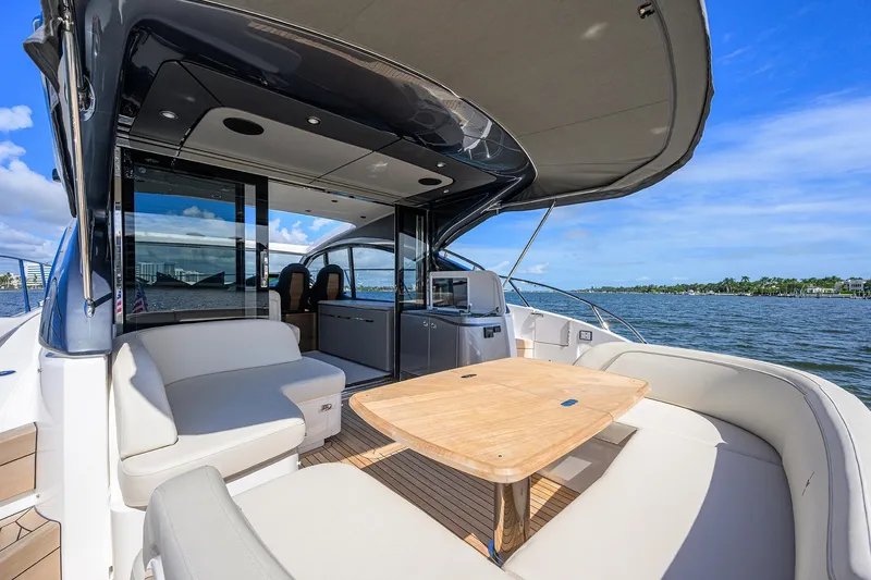 Slide: The Image of Luxurious 2026 Princess V50 Deck Salon yacht with elegant seating and scenic water view. - 10