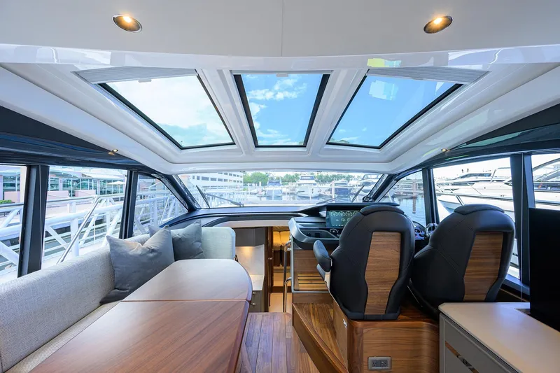 Slide: The Image of Luxurious interior of 2026 Princess V50 Deck Salon yacht with panoramic windows and modern seating. - 22