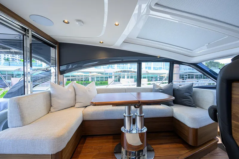 Slide: The Image of Luxurious interior of 2026 Princess V50 Deck Salon yacht with elegant seating and table. - 3