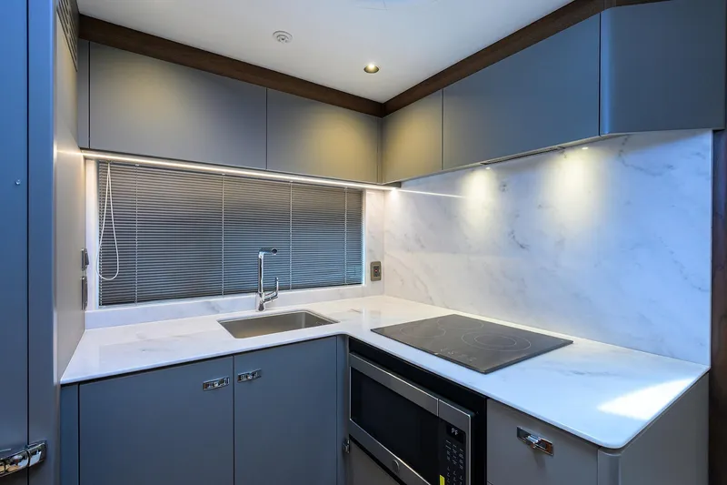 Slide: The Image of Modern kitchen in 2026 Princess V50 Deck Salon yacht with sleek design and appliances. - 31