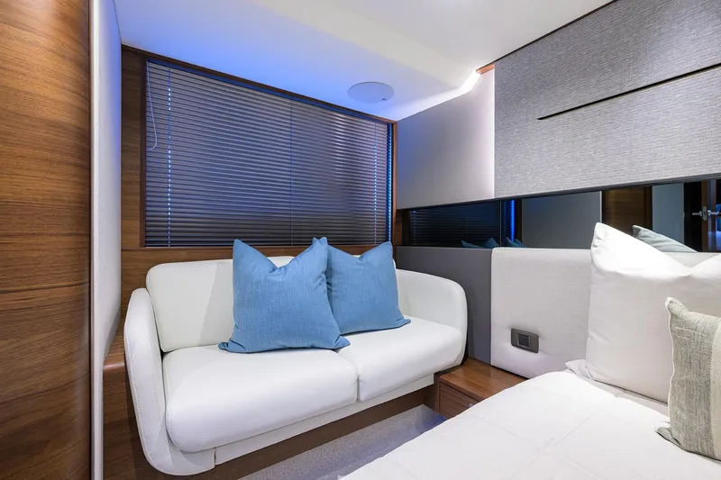 Slide: The Image of Luxurious interior of 2026 Princess V50 Deck Salon with elegant seating and cushions. - 41