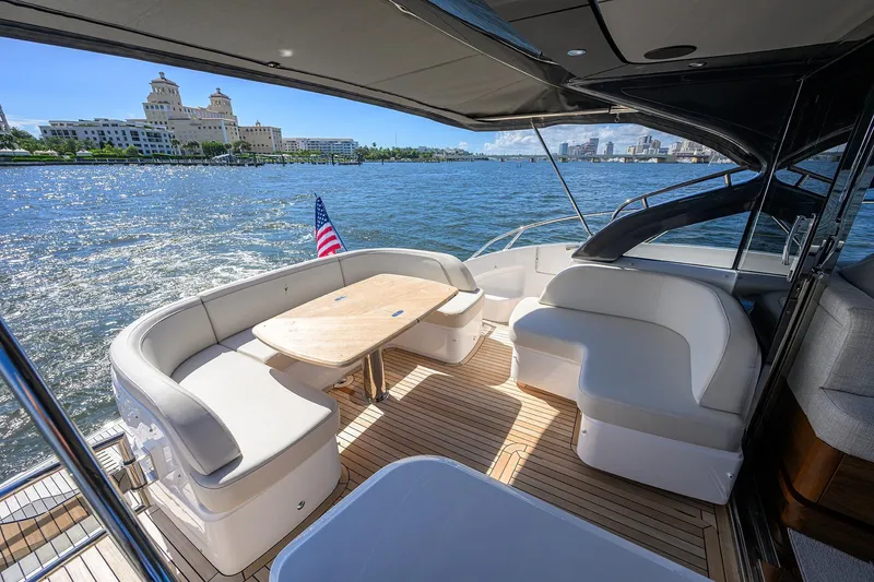 Slide: The Image of Luxurious 2026 Princess V50 Deck Salon yacht with elegant seating and scenic waterfront view. - 8