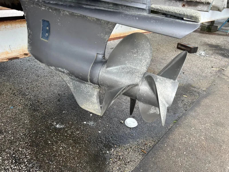 Slide: The Image of Compact bathroom in 2018 Regal Commodore 258 boat, featuring a toilet and storage cabinet. - 4