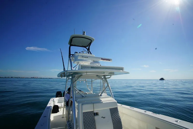 Slide: The Image of 2018 SeaVee 390Z boat on calm ocean under clear blue sky. - 10