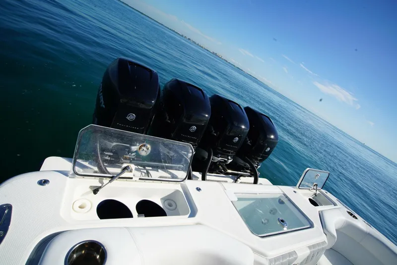 Slide: The Image of 2018 SeaVee 390Z boat with four powerful outboard engines on open water. - 17