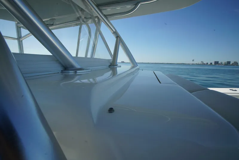 Slide: The Image of 2018 SeaVee 390Z boat deck with ocean view and clear blue sky. - 26