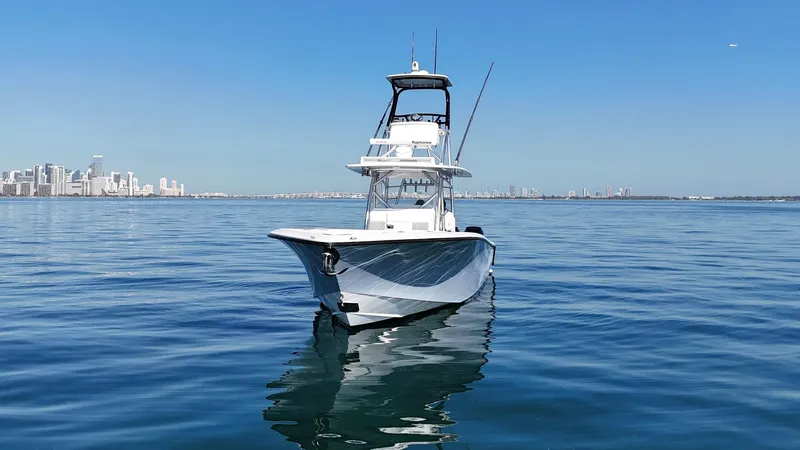 Slide: The Image of 2018 SeaVee 390Z boat on calm water with city skyline in background. - 3