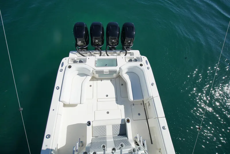 Slide: The Image of 2018 SeaVee 390Z boat with four outboard engines, viewed from above on clear water. - 6